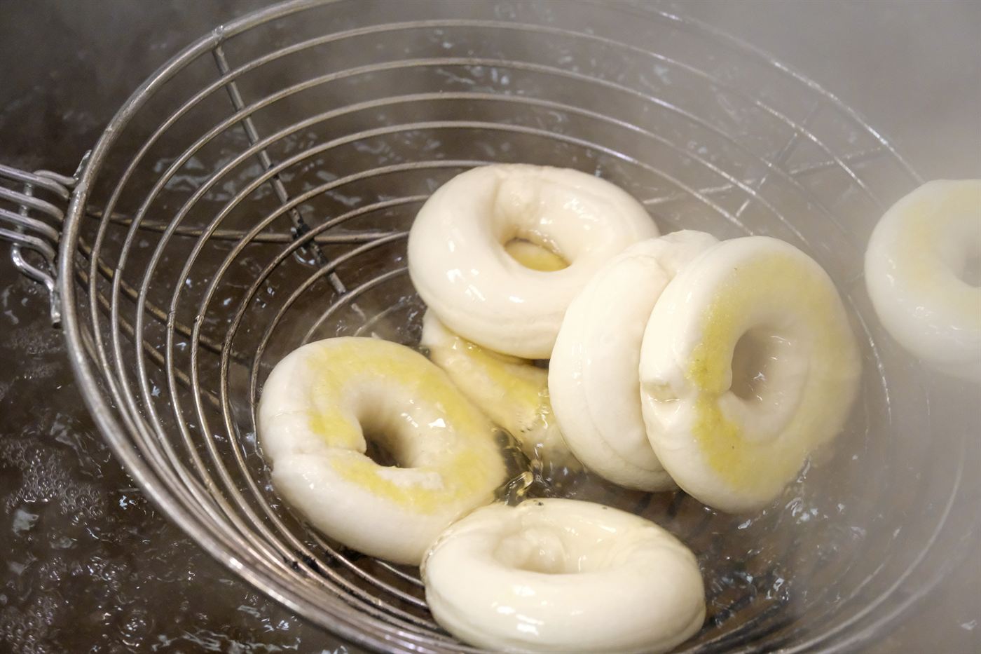 Bagels being kettle boiled